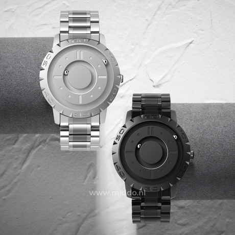 montre magnétique argent et noire côte à côte sur fond gris, design minimaliste épuré