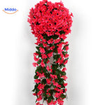 orchidées artificielles rouges suspendues au mur, accent de couleur intense pour toute occasion