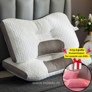 oreiller cervical ergonomique avec 2 taies en velours rose offertes, sur un lit