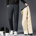 pantalon thermo gris présenté à côté de la doublure polaire beige retournée