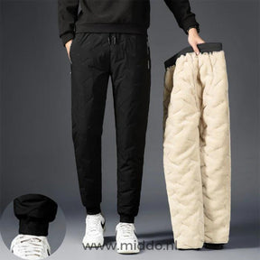 pantalon thermo imperméable noir avec doublure polaire beige étalé à plat