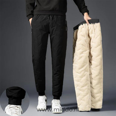 pantalon thermo imperméable noir avec doublure polaire beige étalé à plat