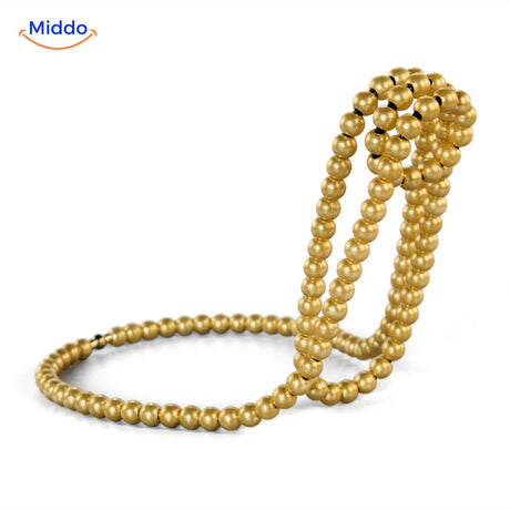 porte-bouteille élégant orné de perles dorées façon bijou, pour une table chic