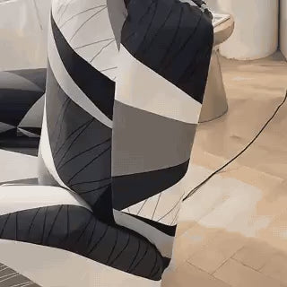 housse extensible pour fauteuil relax avec motif géométrique noir, blanc et gris, vue en situation