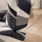 housse extensible pour fauteuil relax avec motif géométrique noir, blanc et gris, vue en situation