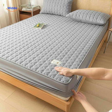 protège-matelas avec coins élastiques antidérapants maintenant la housse bien en place
