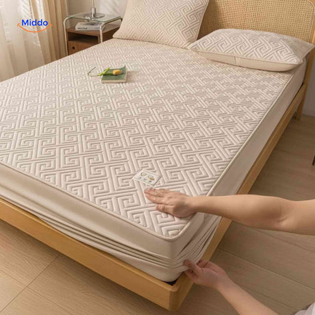 gros plan sur le motif géométrique quilté du protège-matelas respirant et doux