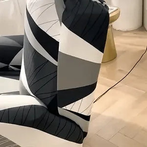 housse extensible pour fauteuil relax avec motif géométrique noir, blanc et gris, vue en situation