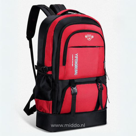 sac à dos de voyage 65l coloris rouge avec bretelles réglables et sangles de compression