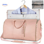 sac de voyage compact luxe en coloris rose, photo produit fond épuré