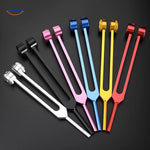 set de diapasons thérapeutiques en plusieurs coloris posés côte à côte