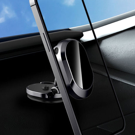 téléphone maintenu sur le tableau de bord grâce au support magnétique voiture