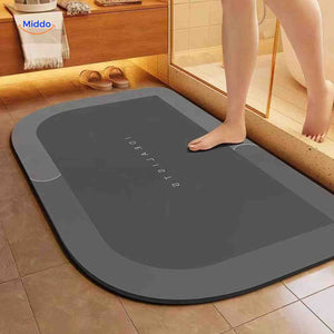 tapis de bain rectangulaire gris foncé retourné, semelle antidérapante visible